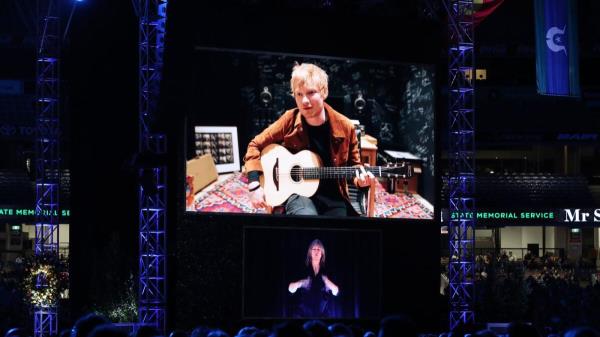 Musician Ed Sheeran performs via video l<em></em>ink during the memorial service. — AP