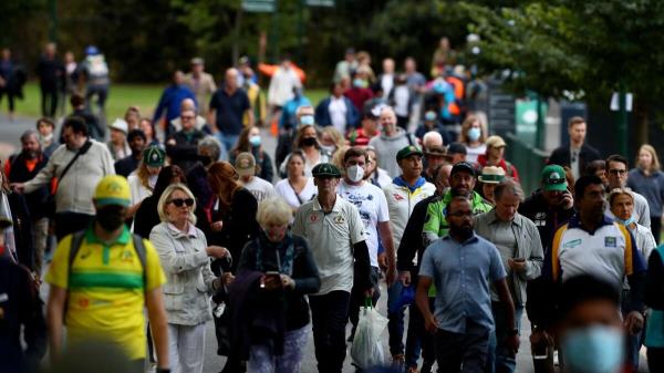 Cricket fans arrive to attend the state memorial service.— AFP
