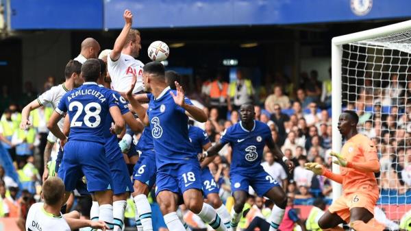 Tottenham Hotspur's English striker Harry Kane heads home their late second goal. (AFP)