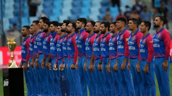 Afghanistan players stand for their natio<em></em>nal anthem before the start of the match against India. — AP