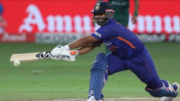 India's Rishabh Pant plays the reverse sweep against Pakistan. — AFP