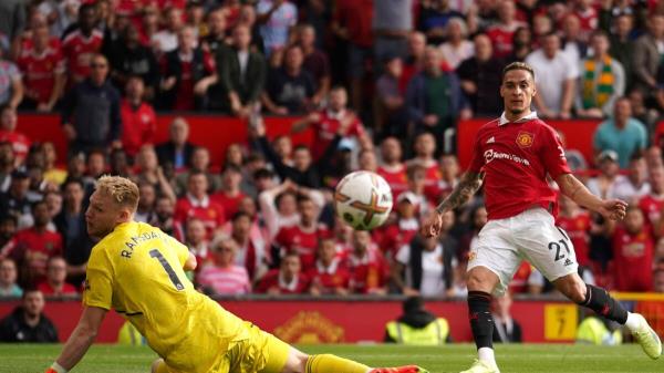 Manchester United's Antony (right) scores past Arsenal' goalkeeper Aaron Ramsdale at Old Trafford on Sunday. — AP